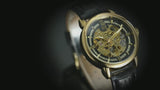 Heren Skeleton opwind goudkleurig horloge van Benssens met zwarte leren band